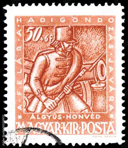 Stamp printed by Hungary, shows shows gunner with cannon