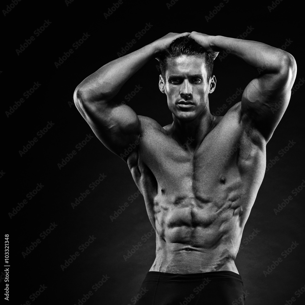 Fototapeta premium Portrait of a handsome muscular bodybuilder posing