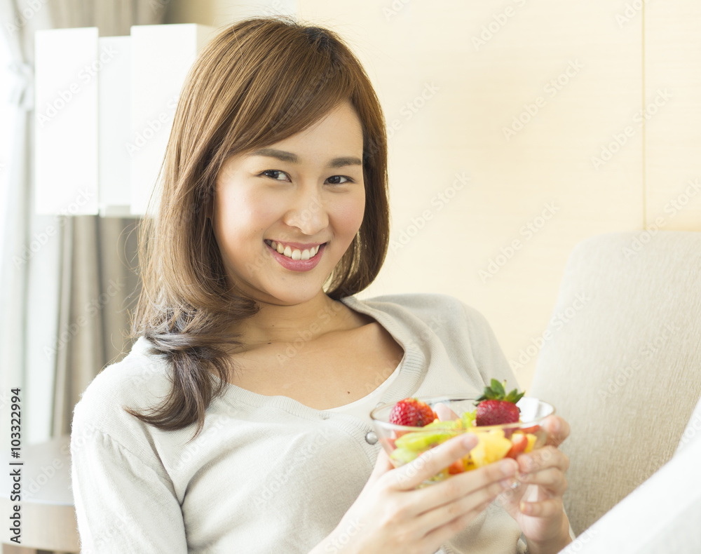 Asian woman with fruit salad