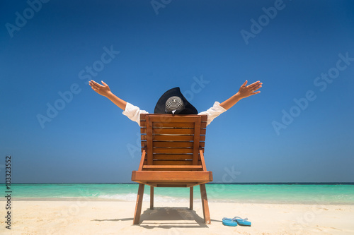 Happy young woman on the beach