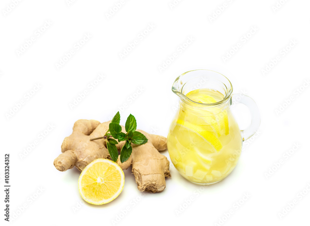 Ginger tea with lemon, ginger root and mint on white background Ginger tea with lemon, ginger root and mint on white background
