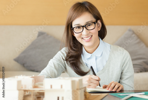 Asian woman working at home