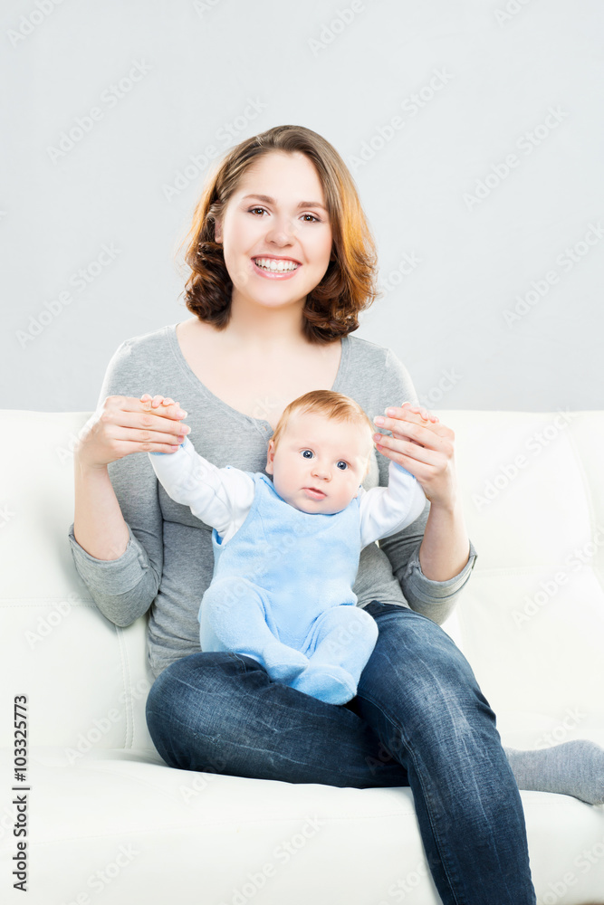 Young mother and her baby child. Infant son and his mom. Young mother and her baby child. Infant son and his mom.
