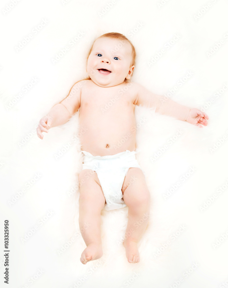 Portrait of a cute smiling infant baby in a diaper. Portrait of a cute smiling infant baby in a diaper.