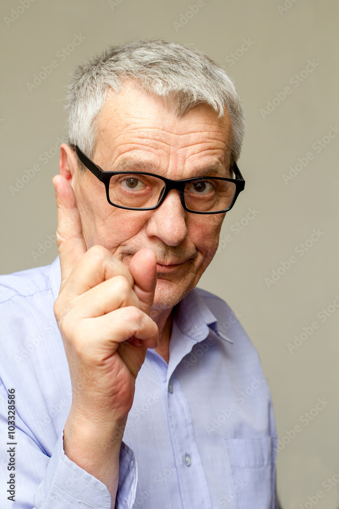 Confident mature man in formalwear pointing you Confident mature man in formalwear pointing you