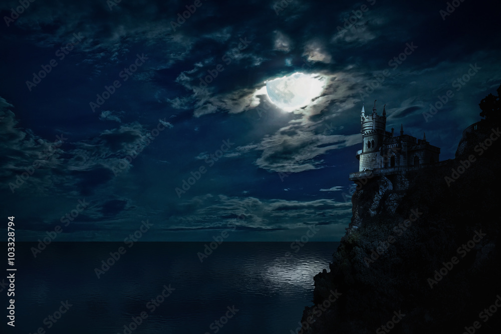Night seascape with the moon and the castle on the hill