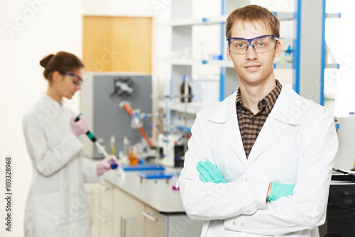 scientific researchers making experiment in laboratory