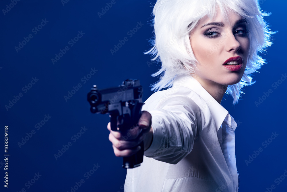 beautiful sexy girl holding gun . smoke background beautiful sexy girl holding gun . smoke background