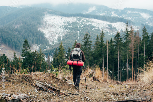 caucasian male hiking in mountains