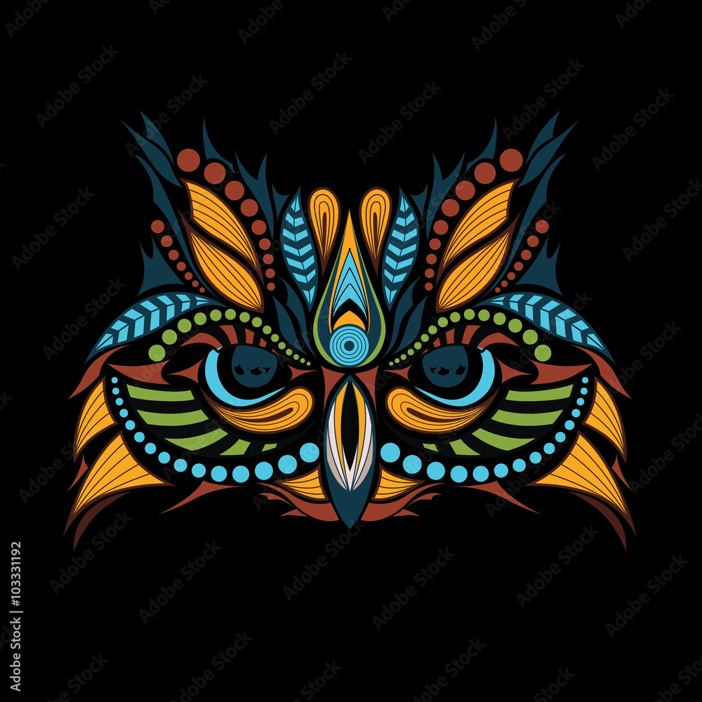 Patterned colored head of the owl on black. African / indian / totem / tattoo design. It may be used for design of a t-shirt, bag, postcard and poster.