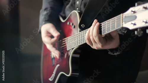 Man playing acoustic guitar