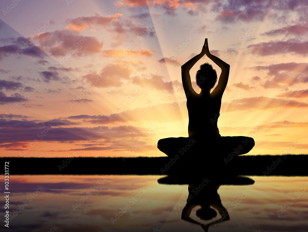 Silhouette of a girl practicing yoga Silhouette of a girl practicing yoga