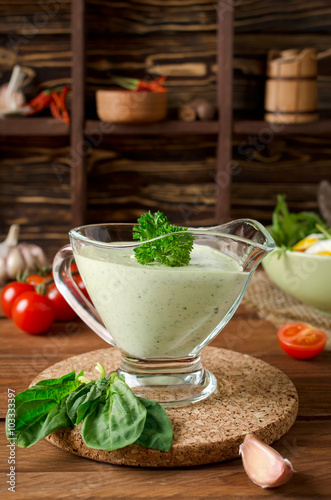 Fresh green sauce with spinach on a dark background