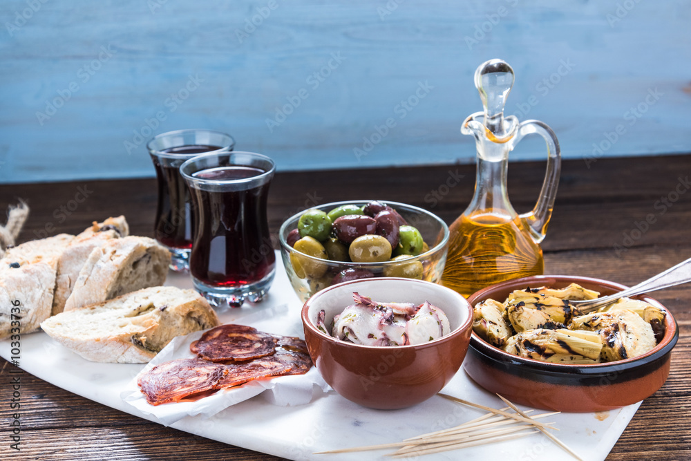 Traditional tapas served on marble board Traditional tapas served on marble board