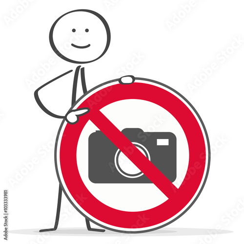 Strichmännchen zeigt auf das Fotoverbotsschild