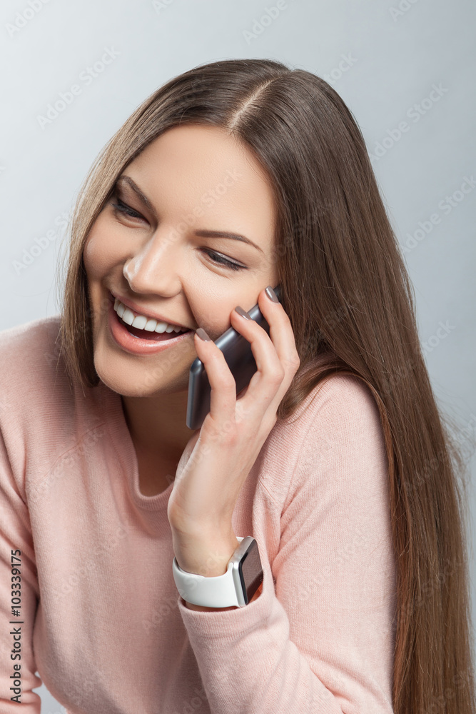Attractive girl is using telephone for communication Attractive girl is using telephone for communication