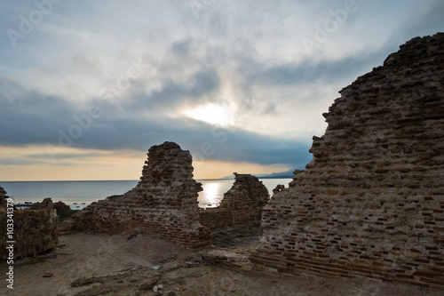 Beach with ruins of old roman city of Nora, Sardinia, Italy