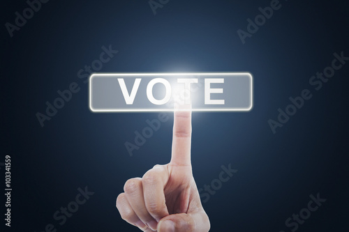 Person pressing vote button on virtual screen