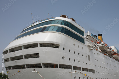 Side view of cruise ship on the blue sky background © OceanProd