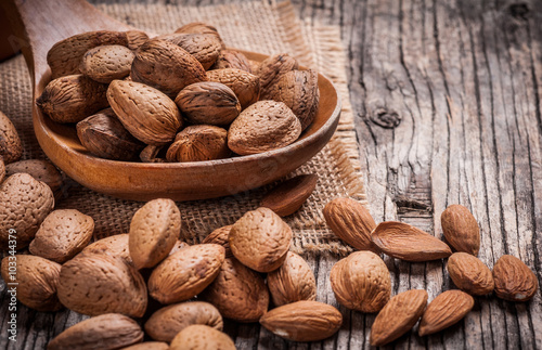 Almond nuts in mixing scoop 