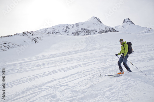 skier braking at the end of the mountain