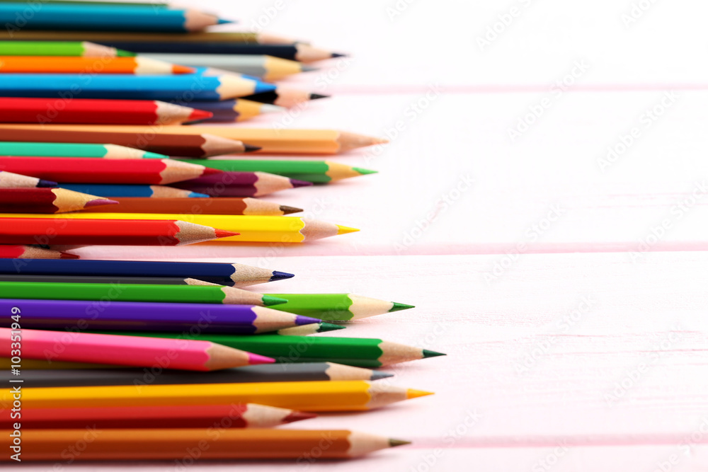 Drawing colourful pencils on a wooden background Drawing colourful pencils on a wooden background