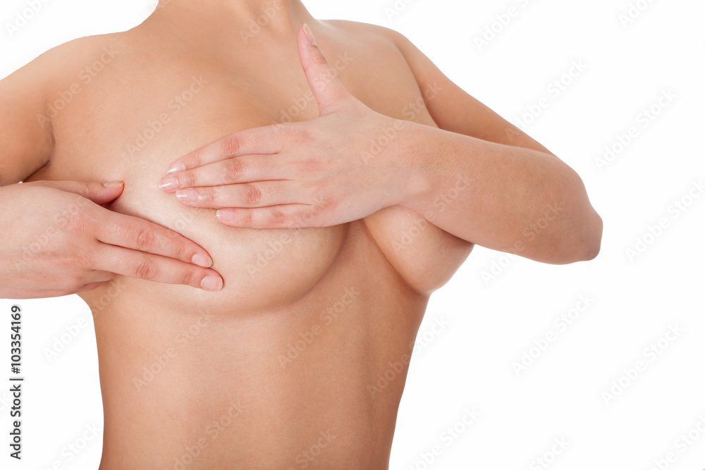 Female's body- examining breasts. Isolated on white.