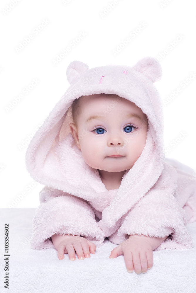 little baby girl in pink bathrobe lying on her belly little baby girl in pink bathrobe lying on her belly