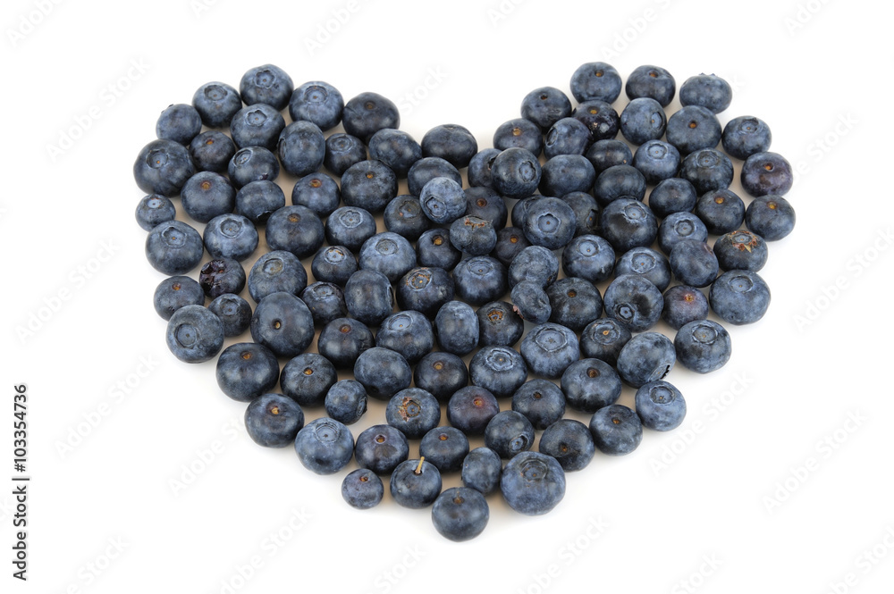 blueberries arranged in heart shape isolated on white background blueberries arranged in heart shape isolated on white background