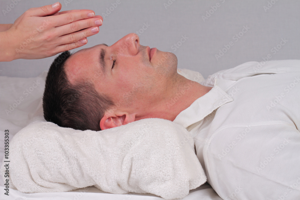 Man having reiki healing treatment , alternative medicine concept. Man having reiki healing treatment , alternative medicine concept.