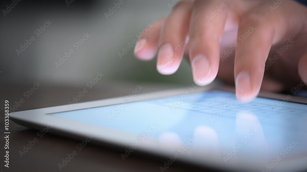 Hand touching screen on modern digital tablet pc.