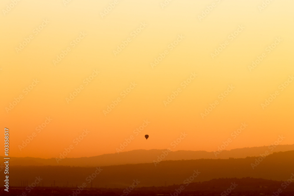 Balloon at sunset