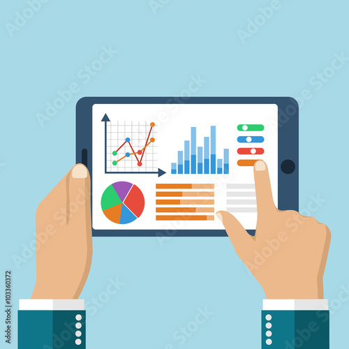 The tablet in the hands of a businessman with statistical data p