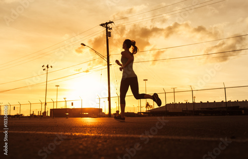 Fototapeta Naklejka Na Ścianę i Meble -  Young female running. 