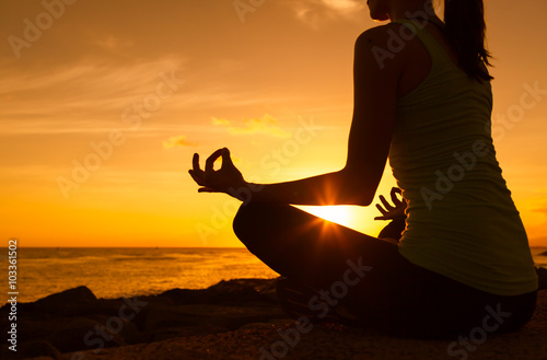 Peaceful yoga in a beautiful sunset. 