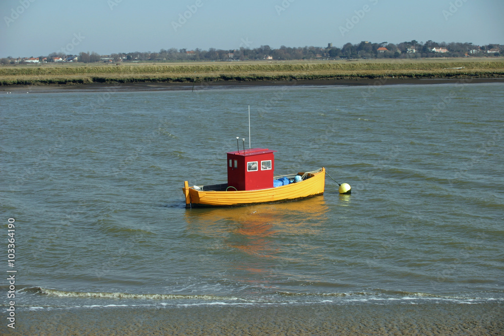 Fototapeta premium Colourful boat on river