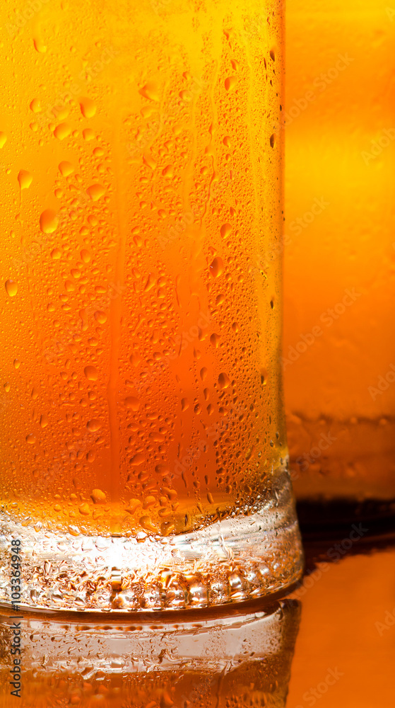 Mug with cold beer. Detail close-up Mug with cold beer. Detail close-up