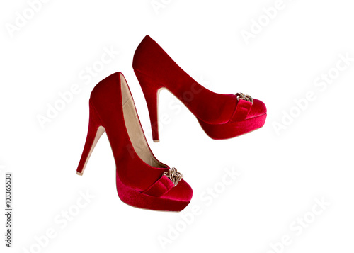 Pair of high heel red female shoes isolated on white background.