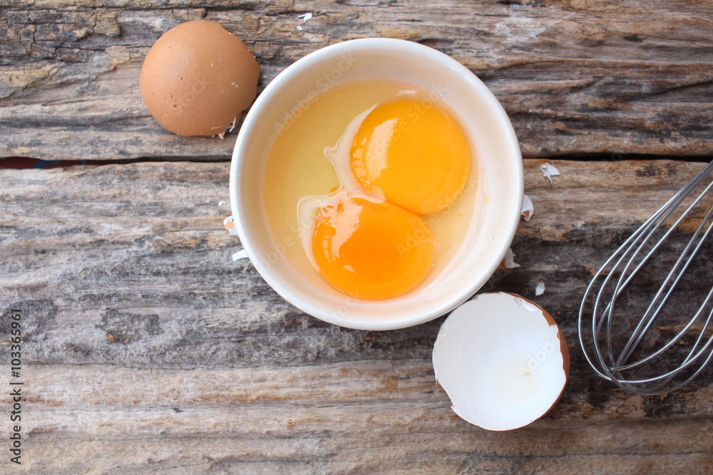 Eggs in a bowl with whisk Eggs in a bowl with whisk