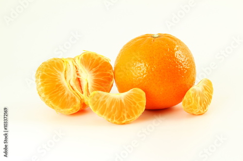 Ripe mandarin  tangerine orange  closeup on a white background