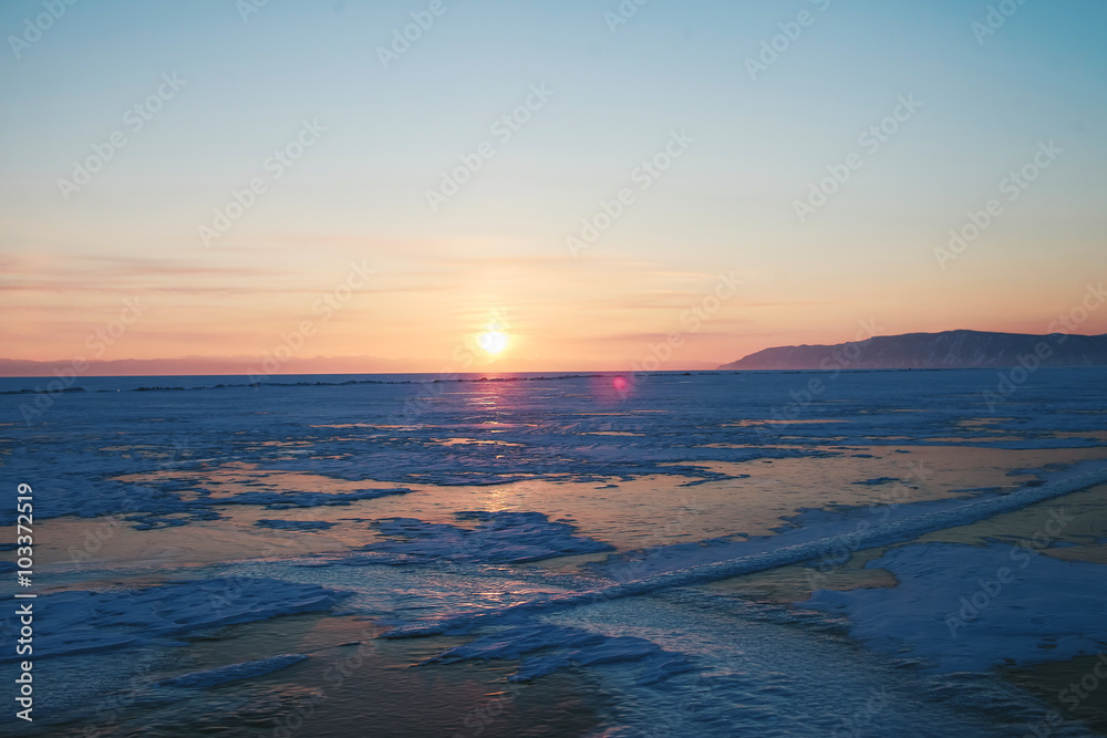 sunset on a frozen lake Baikal sunset on a frozen lake Baikal