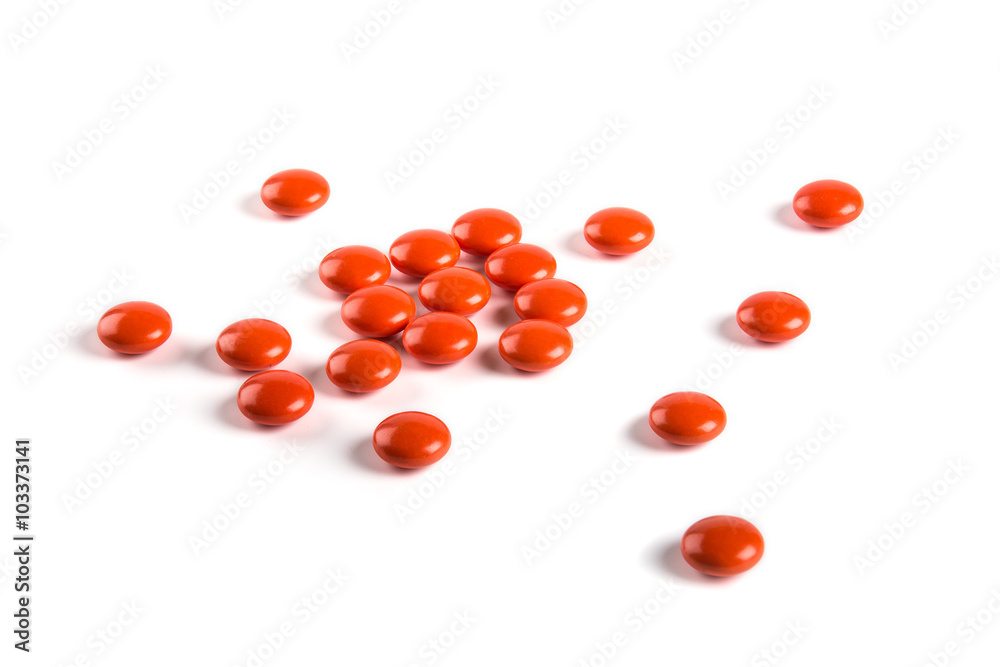 Red tablets on white background Red tablets on white background