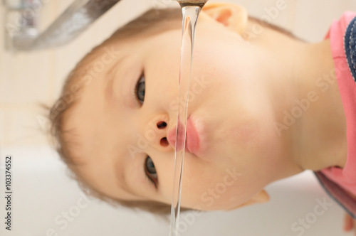 Little girl quench her thirst