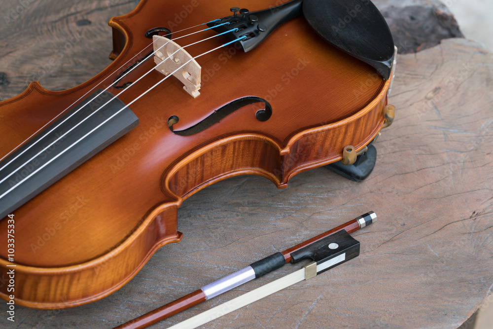 Fototapeta premium Close up of a violin on wooden surface 