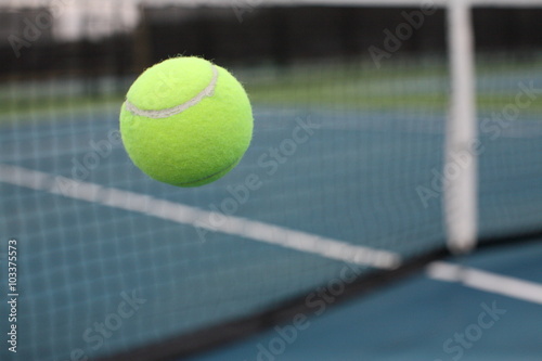Tennis Ball in Front Behind Net Mid Air in Motion Moving Bouncing Flying © cpcthatsme