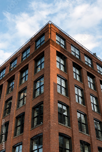 Corner of Low Rise Building with Red Brick Facade