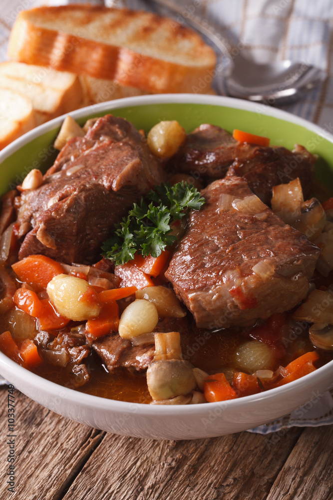Beef Bourguignon with mushrooms close up in a bowl. Vertical
Beef Bourguignon with mushrooms close up in a bowl. Vertical