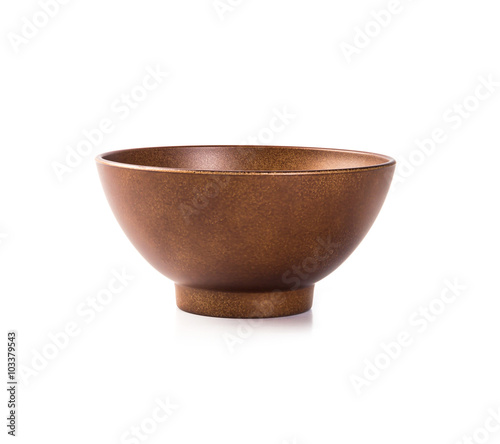 vintage brown bowl isolated on white background © Cozine