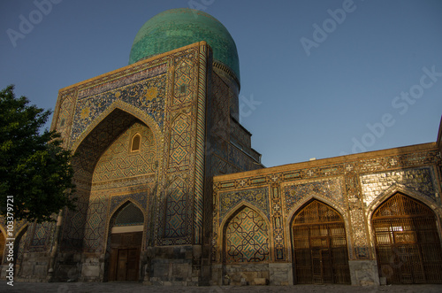 Morning sun in wall of madrasas with traditional mosaic ornament . Samarkand, Uzbekistan