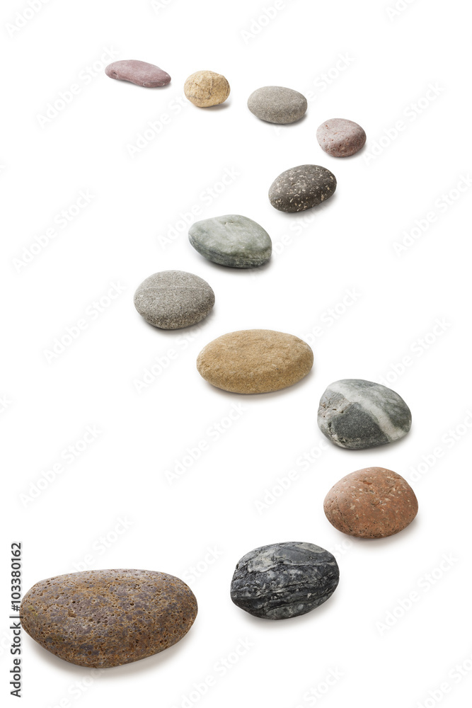 A curving row of pebbles representing stepping stones, isolated on white with clipping path around pebbles. A curving row of pebbles representing stepping stones, isolated on white with clipping path around pebbles.